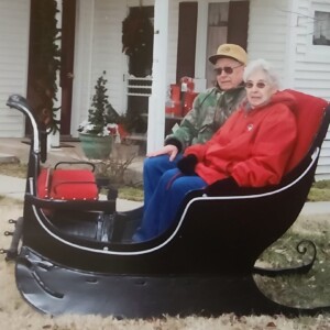 Linot and her late husband, Tom, celebrating Christmas in front of their home.